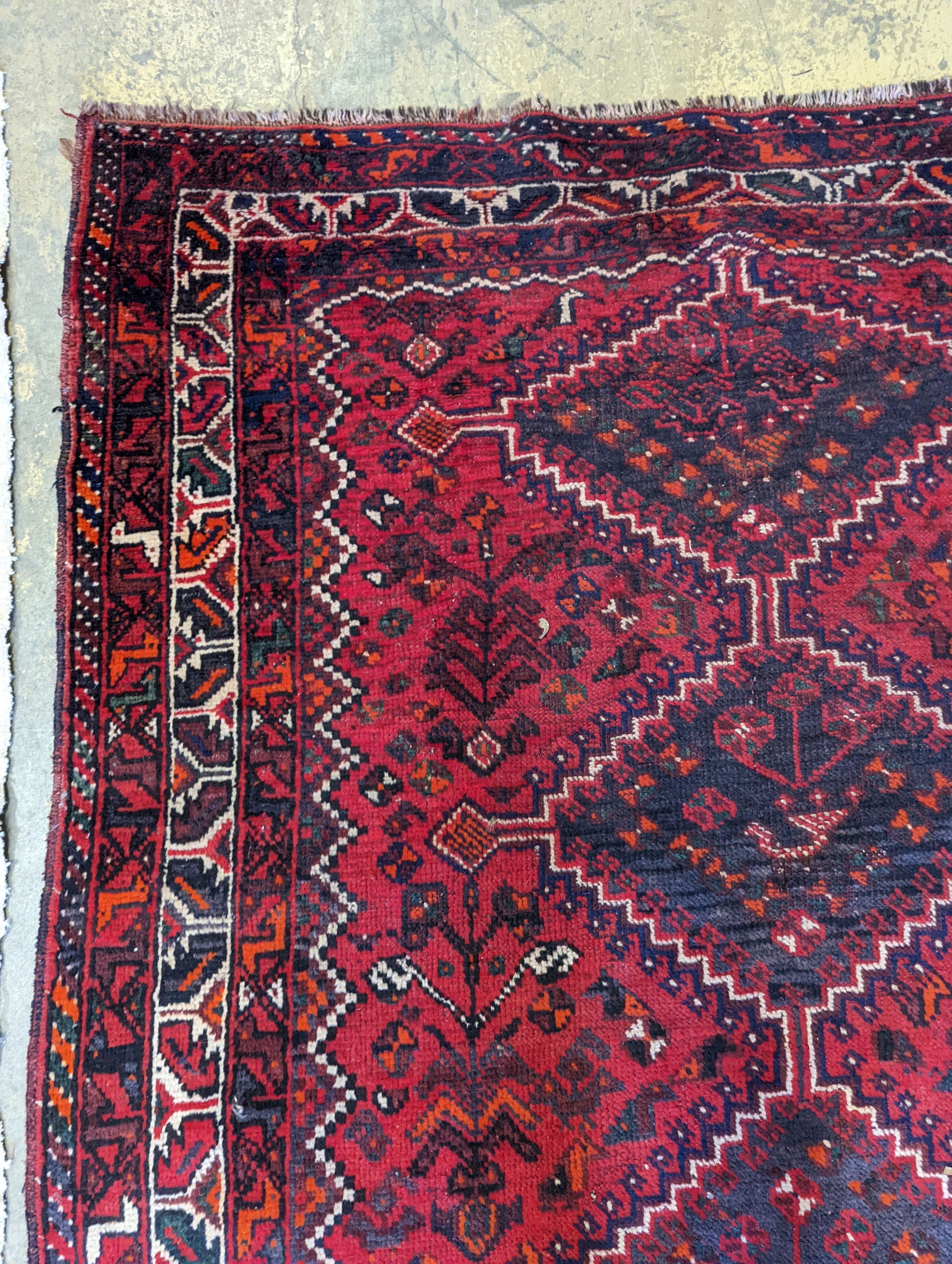 A Caucasian design red ground rug, 200 x 160cm